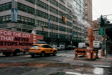 For the city that never stops moving written on van driving past