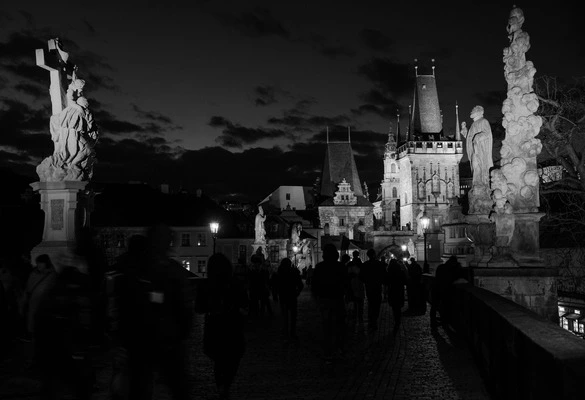 Black and white photo of statues on Charles Bridge, Prague