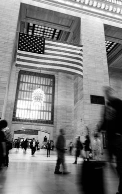 b/w Central Station New York with flag